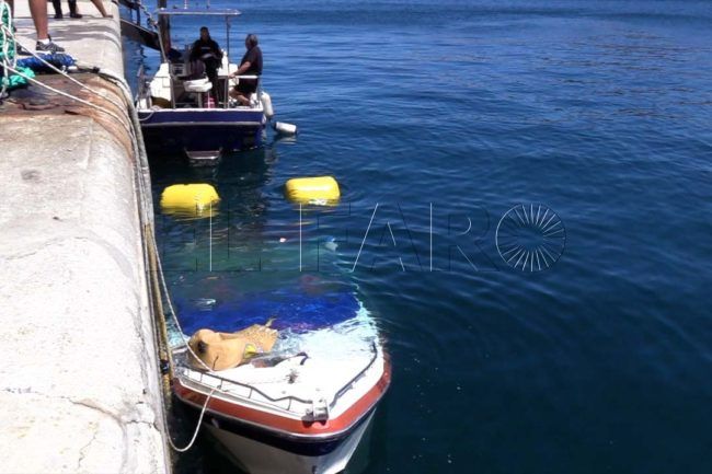 Costosas labores para reflotar una lancha hundida en el muelle de España